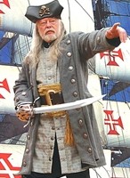 Bucaneer coat in grey, shown with long vest, wide pirate belt and tasseled pirate sash